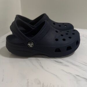 Crocs kids size 12 navy blue classic shoe.  
Excellent condition